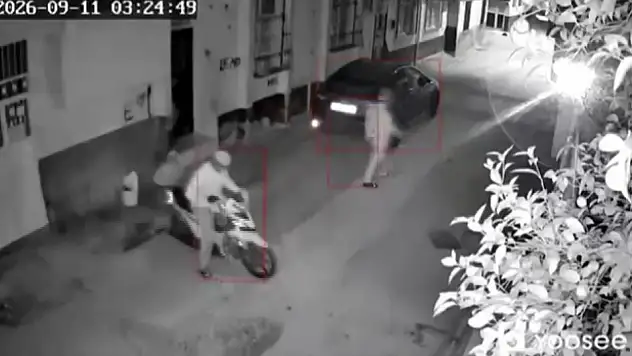 Kasklı şüpheli eve ateş açıp kaçtı!