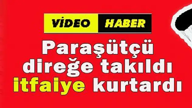 Paraşütçü direğe takıldı, itfaiye kurtardı 