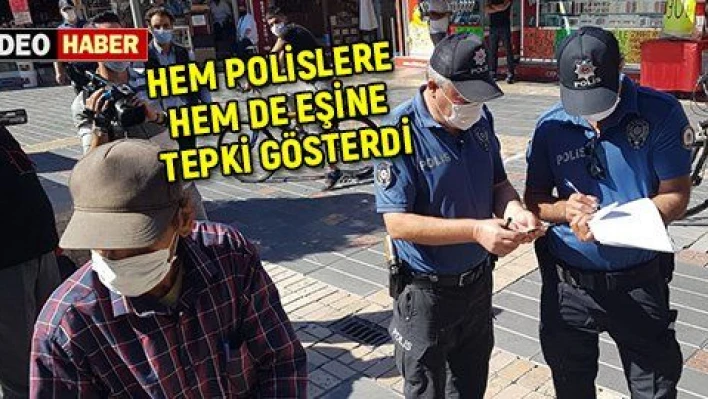 Ceza kesilirken hem eşine hem de polislere tepki gösterdi